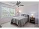 Cozy bedroom featuring a large window and contemporary decor at 17733 Burnt Hickory Dr, Charlotte, NC 28278
