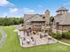 An aerial view of the clubhouse with an outdoor patio, tables, and chairs for residents to enjoy at 17733 Burnt Hickory Dr, Charlotte, NC 28278