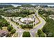 Aerial view of the community amenities, including a pool, sports courts, clubhouse, and surrounding neighborhood at 17733 Burnt Hickory Dr, Charlotte, NC 28278