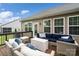 Relaxing outdoor deck featuring stylish wicker furniture and comfortable blue cushions, perfect for entertaining at 17733 Burnt Hickory Dr, Charlotte, NC 28278