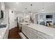 Stylish kitchen features an oversized island, stainless appliances, and hardwood floors at 17733 Burnt Hickory Dr, Charlotte, NC 28278