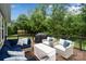 Outdoor deck featuring comfortable seating arrangements and a grill, perfect for outdoor relaxation and entertaining at 17733 Burnt Hickory Dr, Charlotte, NC 28278