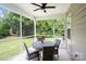 Screened-in porch featuring a ceiling fan and outdoor seating, perfect for entertaining or relaxing at 17733 Burnt Hickory Dr, Charlotte, NC 28278