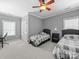 Comfortable bedroom features two twin beds, neutral colors and a window at 1808 Mill Chase Ln, Waxhaw, NC 28173