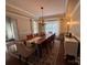 Dining room with hardwood floors, chandelier, and area rug provides an elegant space for dining and entertaining at 1808 Mill Chase Ln, Waxhaw, NC 28173