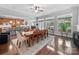 Sunlit dining area adjacent to a modern kitchen, featuring an open floor plan and large windows at 1808 Mill Chase Ln, Waxhaw, NC 28173