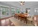 Dining area showcasing hardwood floors, a fireplace, and abundant natural light at 1808 Mill Chase Ln, Waxhaw, NC 28173
