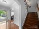Foyer featuring hardwood floors, staircase, and a front door with sidelights allowing for ample natural light at 1808 Mill Chase Ln, Waxhaw, NC 28173