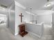 Spacious hallway featuring neutral colors, crown molding, and decorative accents at 1808 Mill Chase Ln, Waxhaw, NC 28173