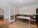 Bright home office with hardwood floors, a modern desk setup, and classic wainscoting at 1808 Mill Chase Ln, Waxhaw, NC 28173