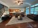 Inviting living room with hardwood floors, comfortable seating, and natural light creates a cozy gathering space at 1808 Mill Chase Ln, Waxhaw, NC 28173