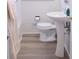 Bathroom with pedestal sink, tile flooring, and white toilet at 1926 Eastway Dr, Charlotte, NC 28205