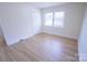 Light-filled bedroom with hardwood floors, closet and natural light at 1926 Eastway Dr, Charlotte, NC 28205