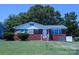 Lovely brick home with neat landscaping, white trim, and a welcoming front entrance at 1926 Eastway Dr, Charlotte, NC 28205
