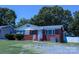 Inviting brick home featuring lush greenery, well-kept lawn, and a traditional design at 1926 Eastway Dr, Charlotte, NC 28205