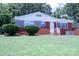 Attractive brick home with manicured lawn, decorative porch accents and curb appeal at 1926 Eastway Dr, Charlotte, NC 28205