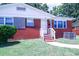 Charming brick home with a well-maintained lawn and inviting front porch at 1926 Eastway Dr, Charlotte, NC 28205