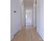 Hallway featuring clean design elements, light-colored hardwood floors and multiple doors at 1926 Eastway Dr, Charlotte, NC 28205