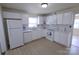 Spotless white kitchen with modern appliances and plenty of natural light from the window at 1926 Eastway Dr, Charlotte, NC 28205