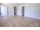 Spacious living room featuring beautiful hardwood flooring, neutral walls and great light at 1926 Eastway Dr, Charlotte, NC 28205