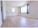 Airy living room featuring sleek hardwood floors and plenty of natural sunlight at 1926 Eastway Dr, Charlotte, NC 28205