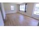 Bright living room with pristine hardwood floors and ample natural light from large windows at 1926 Eastway Dr, Charlotte, NC 28205