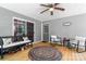 Relaxing back porch with seating, a ceiling fan, and a door leading to the outside at 200 Vista Pointe Dr, Stony Point, NC 28678