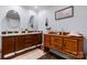 Bathroom with double sink vanity featuring dark wood cabinets and abundant counter space at 200 Vista Pointe Dr, Stony Point, NC 28678