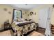 Comfortable bedroom featuring a queen-size bed, a closet, and hardwood style flooring at 200 Vista Pointe Dr, Stony Point, NC 28678