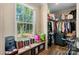 Walk-in closet with a large window overlooking a green landscape and storage for clothing at 200 Vista Pointe Dr, Stony Point, NC 28678