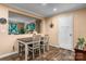 Cozy dining area featuring a wood table, white chairs, and a pass-through to the living room at 200 Vista Pointe Dr, Stony Point, NC 28678