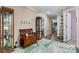 Inviting entryway with wooden bench, modern rug, and display cabinets with decorative touches and hardwood style flooring at 200 Vista Pointe Dr, Stony Point, NC 28678