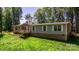 Spacious home exterior featuring a cozy front porch and well-maintained lawn at 200 Vista Pointe Dr, Stony Point, NC 28678