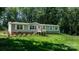 Charming home featuring a welcoming front porch and lush lawn at 200 Vista Pointe Dr, Stony Point, NC 28678