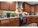 Stylish kitchen with dark cabinetry, stainless appliances, and plenty of counter space with natural light at 200 Vista Pointe Dr, Stony Point, NC 28678
