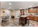 Charming kitchen with warm wood cabinetry, a rustic island with seating, and an adjacent dining area at 200 Vista Pointe Dr, Stony Point, NC 28678