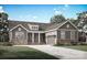 Charming single-story home featuring stone accents, a covered front porch, and an attached two-car garage at 2093 Fordhill St, Rock Hill, SC 29732