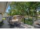 Spacious back deck for outdoor dining, featuring lake views and lush trees, perfect for entertaining at 21212 Rio Oro Dr, Cornelius, NC 28031