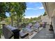 Inviting back deck with comfortable seating, offering beautiful views of the lake and surrounding landscape at 21212 Rio Oro Dr, Cornelius, NC 28031
