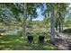 Lush backyard with waterfront view, dock access, and comfortable lounge chairs for relaxation at 21212 Rio Oro Dr, Cornelius, NC 28031