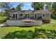 Inviting backyard with deck and paddleboards, ideal for enjoying lake activities at 21212 Rio Oro Dr, Cornelius, NC 28031