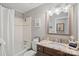Bathroom with tub and shower, vanity with granite countertop, and decorative accents at 21212 Rio Oro Dr, Cornelius, NC 28031