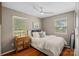 Comfortable bedroom with hardwood floors, neutral walls, and plenty of natural light from two windows at 21212 Rio Oro Dr, Cornelius, NC 28031