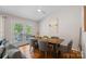 Dining area with hardwood floors and French doors to the deck or patio at 21212 Rio Oro Dr, Cornelius, NC 28031