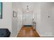 Inviting foyer with hardwood floors, coat closet, and stylish light fixture at 21212 Rio Oro Dr, Cornelius, NC 28031