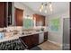 Well-lit kitchen with granite counters, stainless appliances, and tile backsplash at 21212 Rio Oro Dr, Cornelius, NC 28031