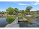 A stunning waterfront view showcases private docks, boats, and neighboring houses at 21212 Rio Oro Dr, Cornelius, NC 28031