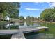Tranquil waterfront with private docks and boat access, providing a serene view at 21212 Rio Oro Dr, Cornelius, NC 28031
