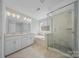 Bright bathroom with a double vanity, a soaking tub, and a separate glass-enclosed shower at 235 Boxelder Rd, Clover, SC 29710