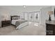 Sun-filled bedroom with neutral walls, soft carpet, and bright windows at 235 Boxelder Rd, Clover, SC 29710